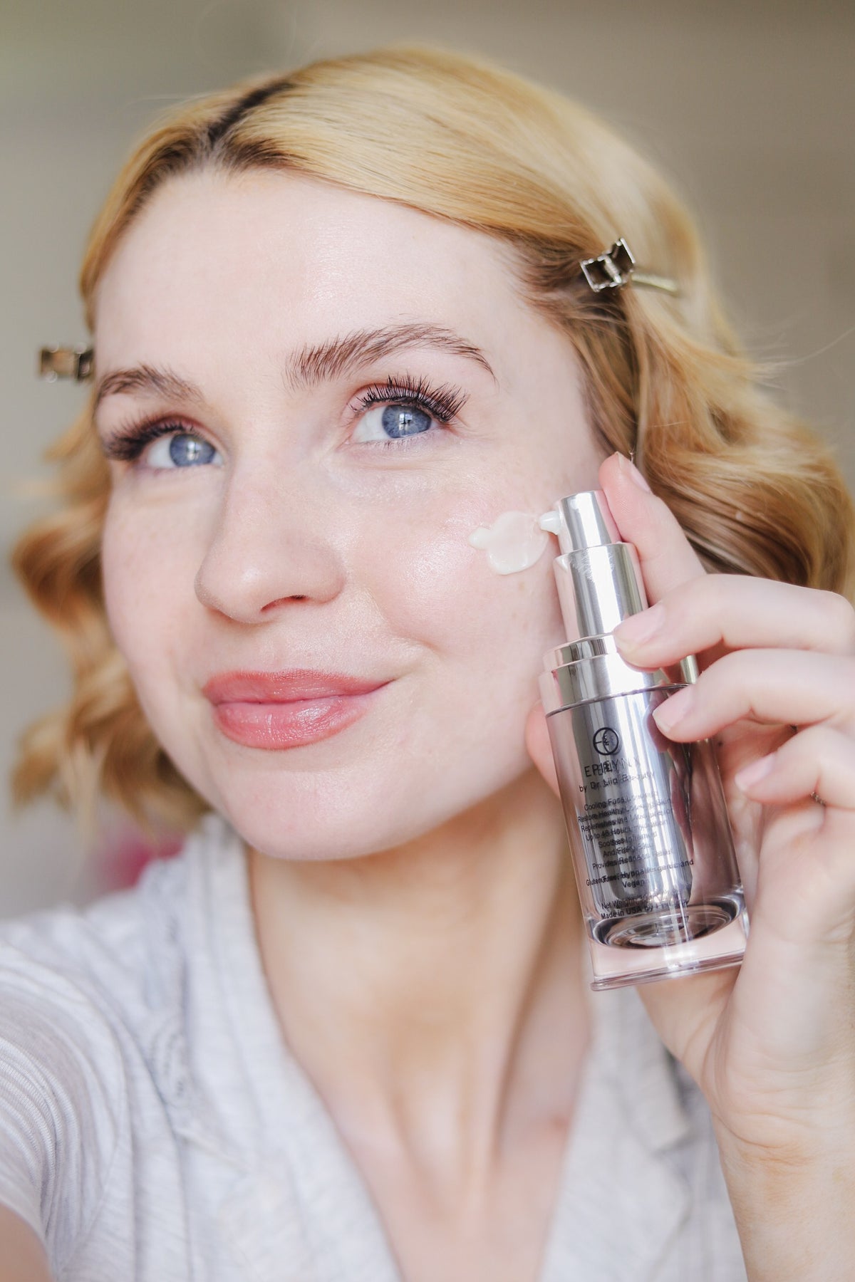 EpiLynx Episilk Crystal face serum dotted onto the cheek before blending