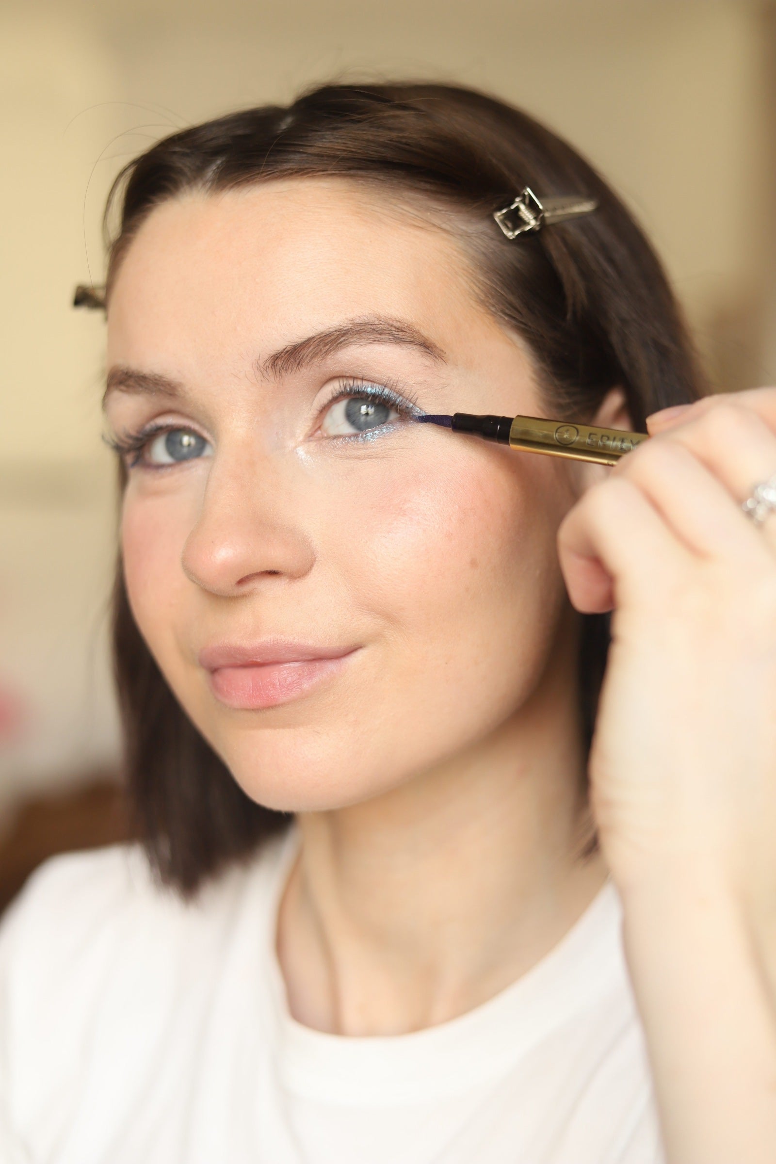 Applying EpiLynx gluten-free vegan eyeshadow to the lid with a brush