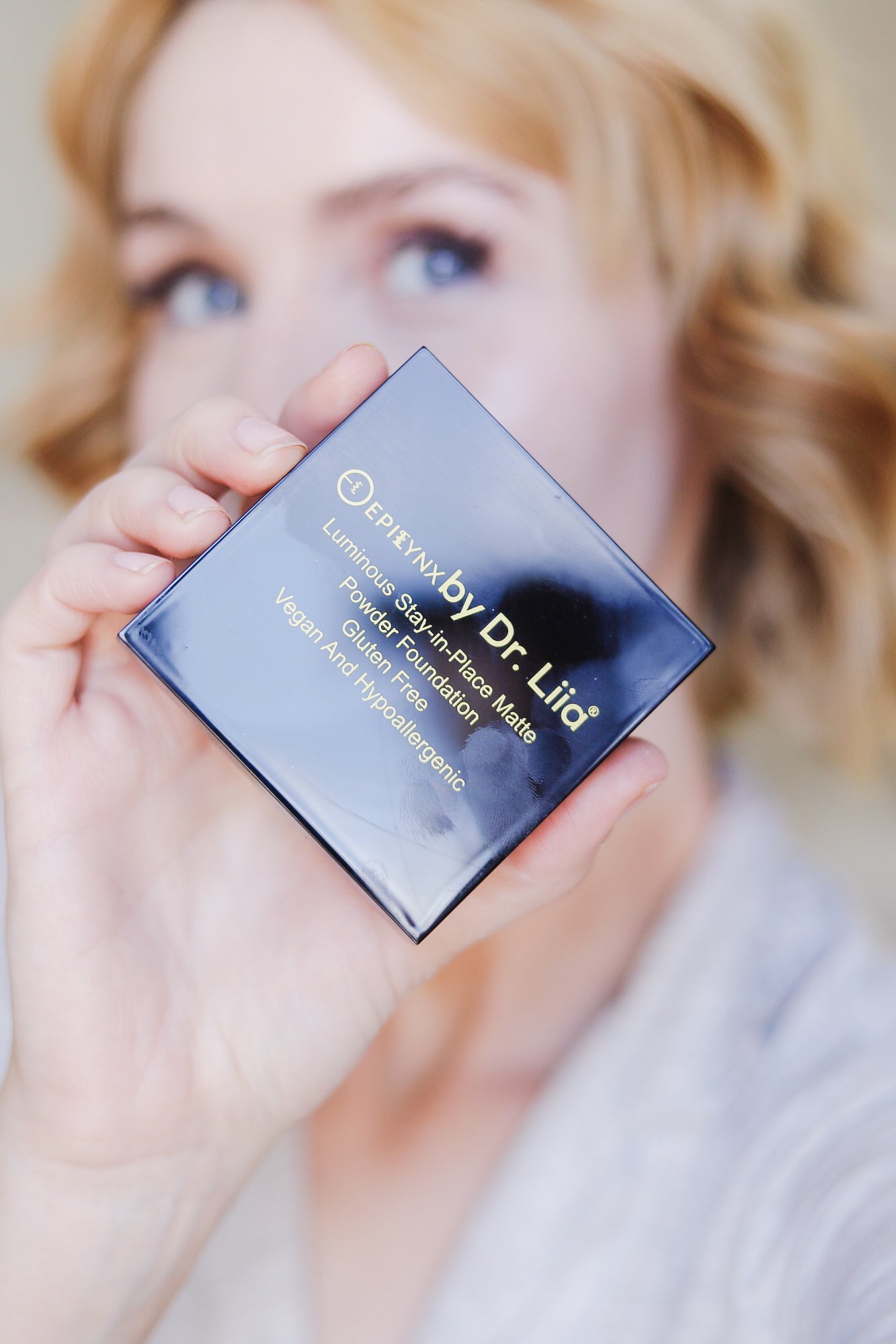 Close-up of the EpiLynx luminous stay-in-place matte powder foundation compact with the label visible