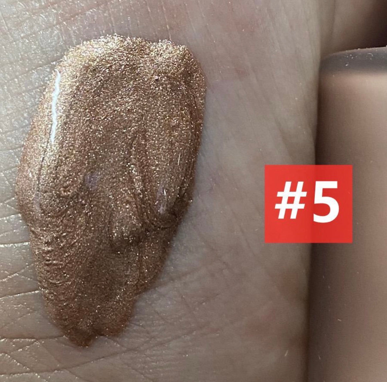 EpiLynx glow drops swatched on skin for a dewy finish