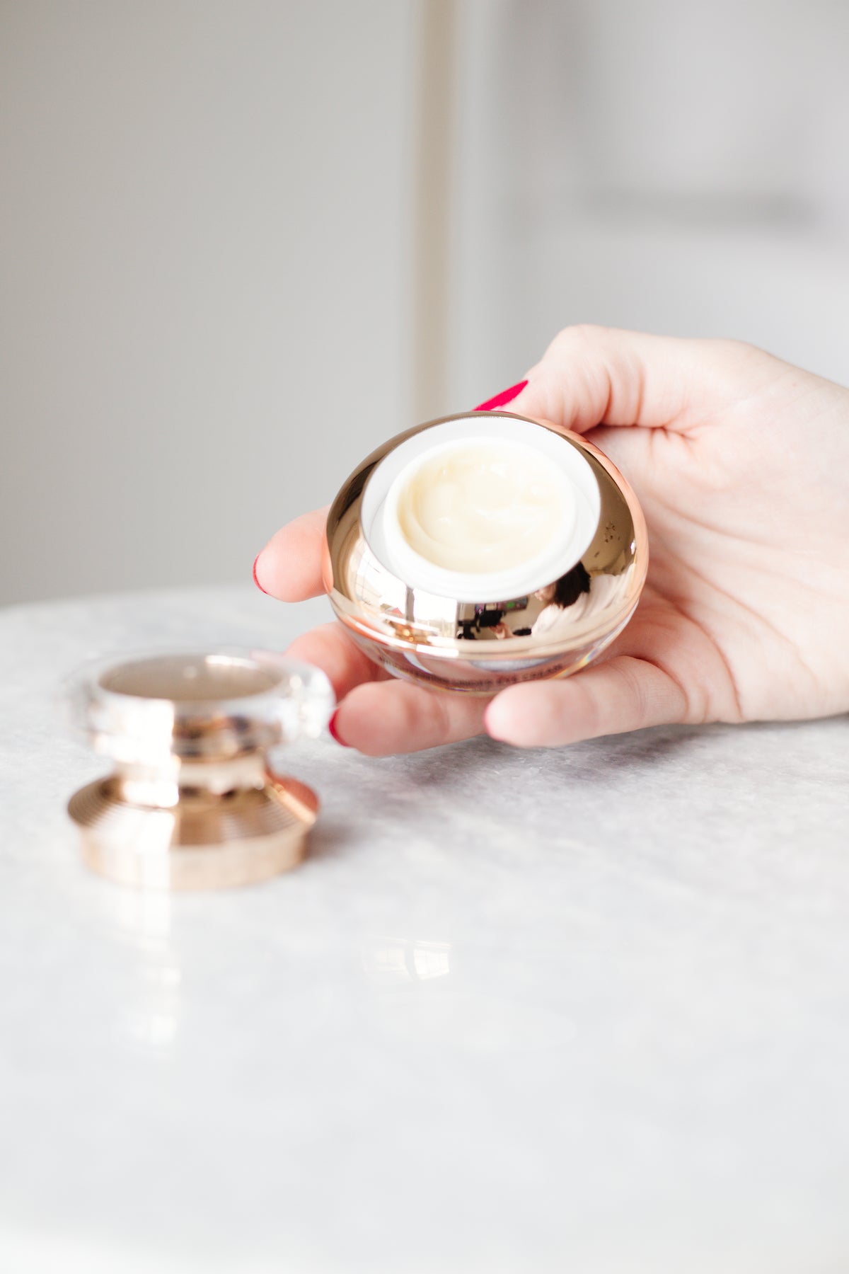 Close-up of EpiLynx anti-aging peptide eye cream texture on a fingertip