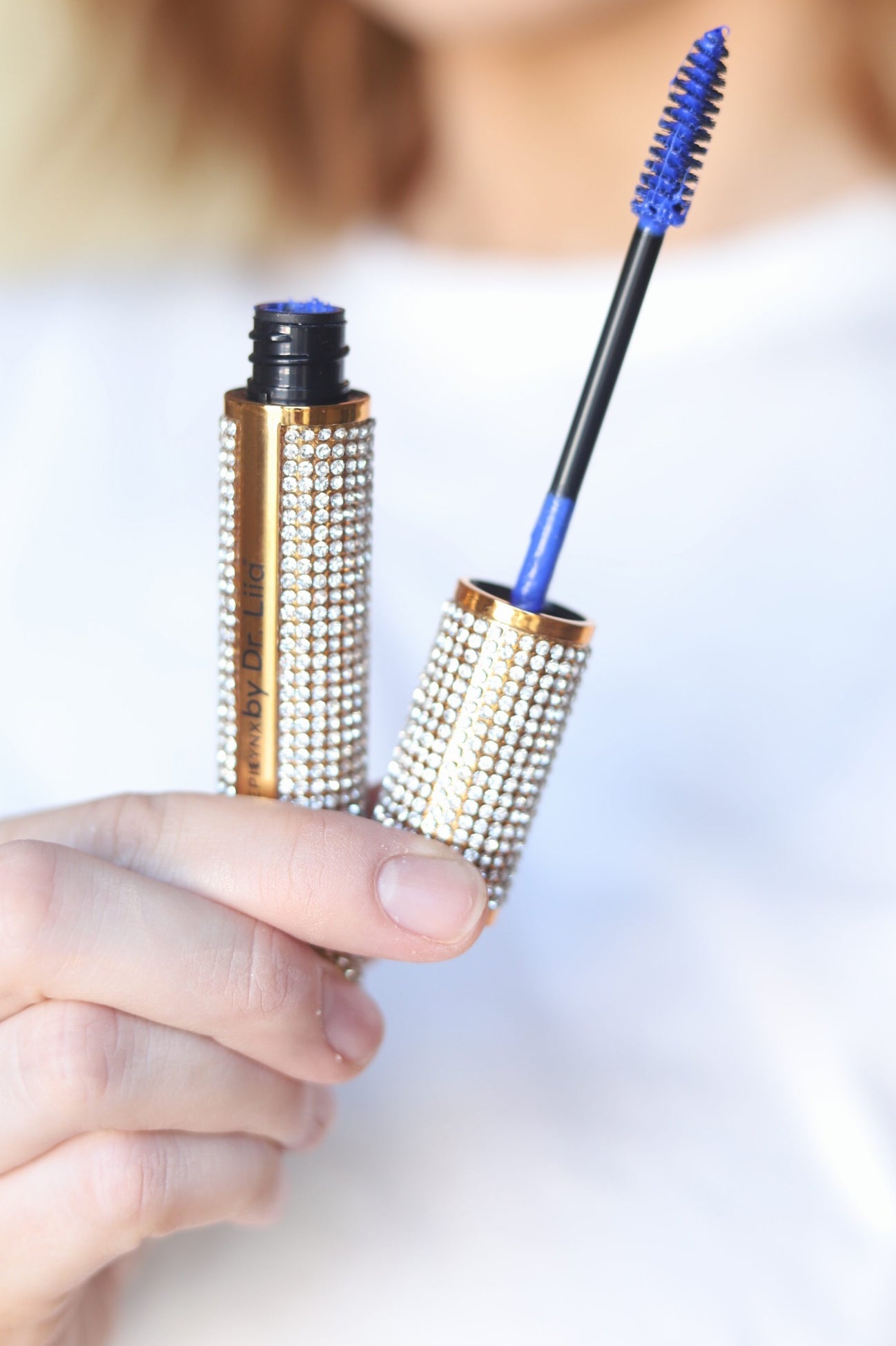 Close-up of the EpiLynx gluten-free vegan mascara, crystal-embellished tube with the blue wand